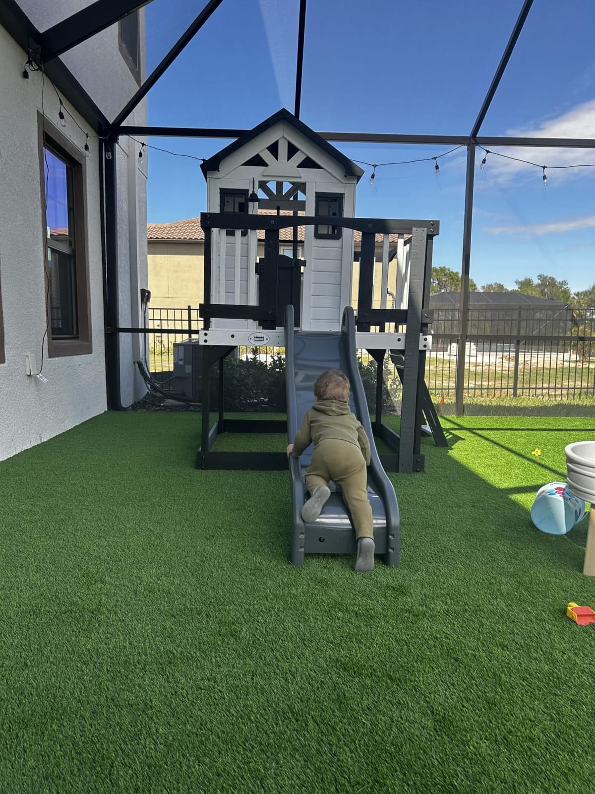 Backyard Discovery Echo Heights Elevated Cedar Wooden Kids Playhouse with Wave Slide, Play Kitchen, Wrap-Around Deck, Flat-Step Ladder, Half Door, Windows, Bell, and Growth Chart for Outdoor Play customer photo 1